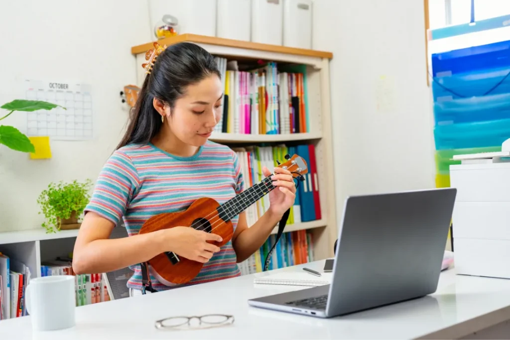 Adult ukulele student practicing ukulele lessons